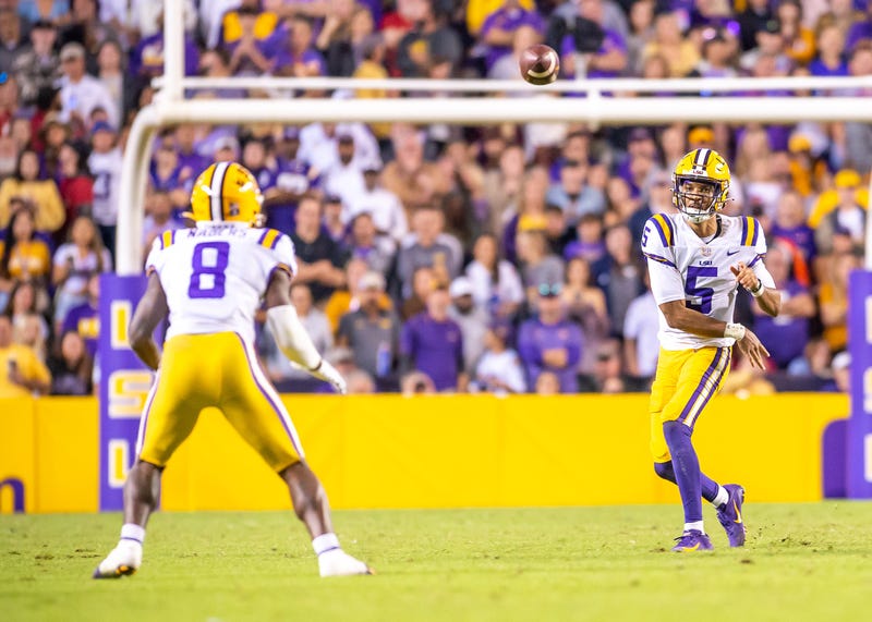 LSU quarterback Jayden Daniels throws a pass to Malik Nabors