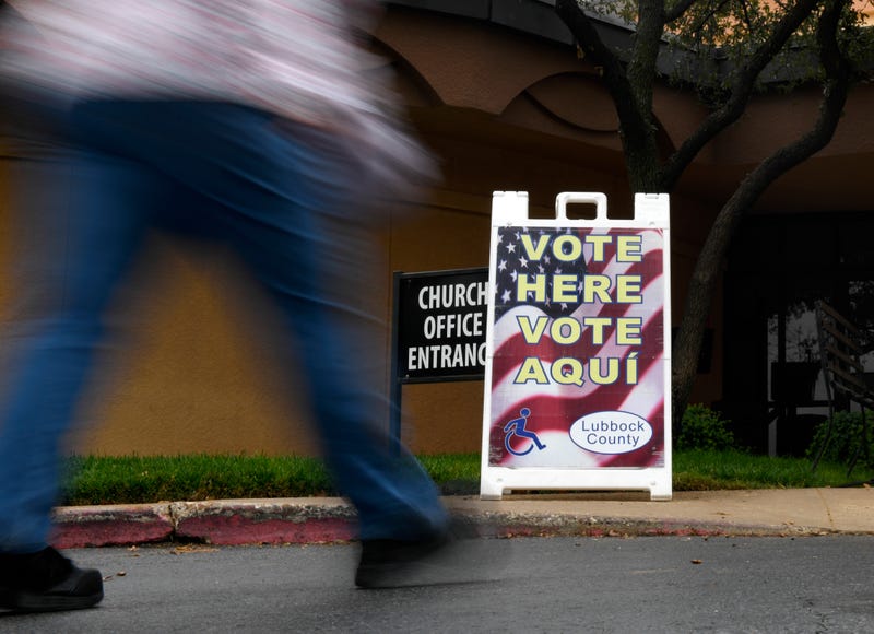 A voter walks to Calvary Baptist Church on Election Day, Tuesday, Nov. 8, 2022, in Lubbock, Texas.