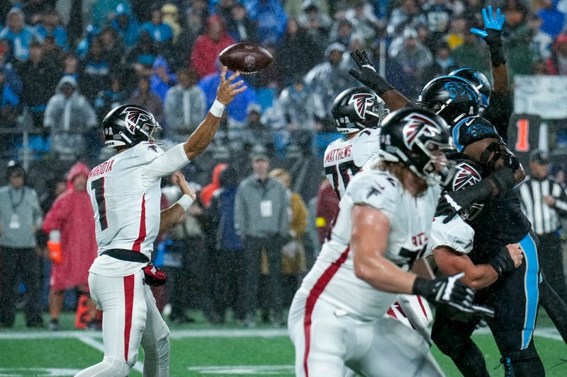 Nov 10, 2022; Charlotte, North Carolina, USA; Atlanta Falcons quarterback Marcus Mariota (1) throws over the Carolina Panthers defense during the second quarter at Bank of America Stadium.
