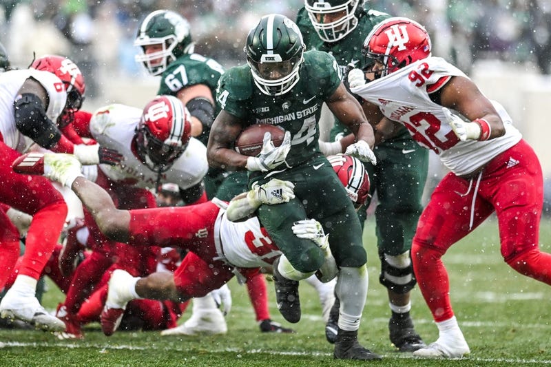 Shaun Shivers ran for 115 yards and scored two touchdowns, including a one-yarder in double overtime, to lift Indiana to a 39-31 come-from-behind victory over Michigan State.