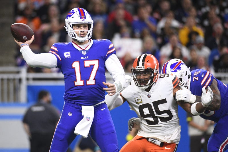 Nov 20, 2022; Detroit, Michigan, USA; Buffalo Bills quarterback Josh Allen (17) drops back to throw the ball as guard Rodger Saffold (76) blocks Cleveland Browns defensive end Myles Garrett (95) during the first half at Ford Field.