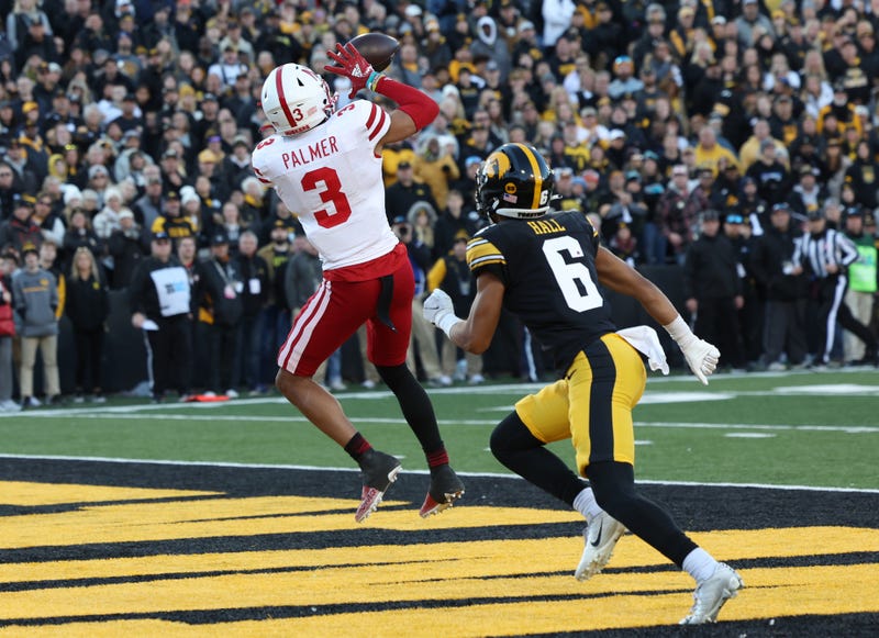 Nebraska Cornhuskers wide receiver Trey Palmer (3) catches a touchdown in front of Iowa Hawkeyes defensive back TJ Hall (6) at Kinnick Stadium.