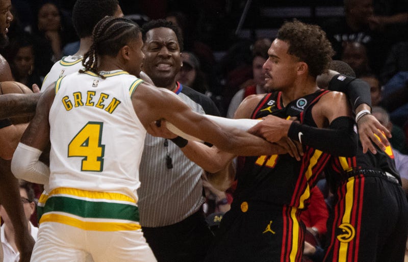 Nov 25, 2022; Houston, Texas, USA; Houston Rockets guard Jalen Green (4) and Atlanta Hawks guard Trae Young (11) get into a shoving match in the third quarter at Toyota Center.
