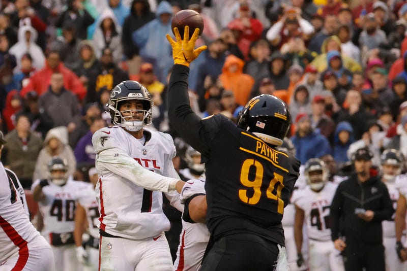 Nov 27, 2022; Landover, Maryland, USA; Washington Commanders defensive tackle Daron Payne (94) tips a pass by Atlanta Falcons quarterback Marcus Mariota (1) ultimately intercepted by Commanders cornerback Kendall Fuller (not pictured) in the end zone in the final minute during the fourth quarter at FedExField. 