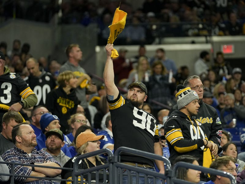 A Pittsburgh Steelers fan waves a towel in the stands during the first half against the Indianapolis Colts