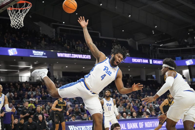  Panthers forward John Hugley IV (4) is fouled by Northwestern Wildcats center Matthew Nicholson 