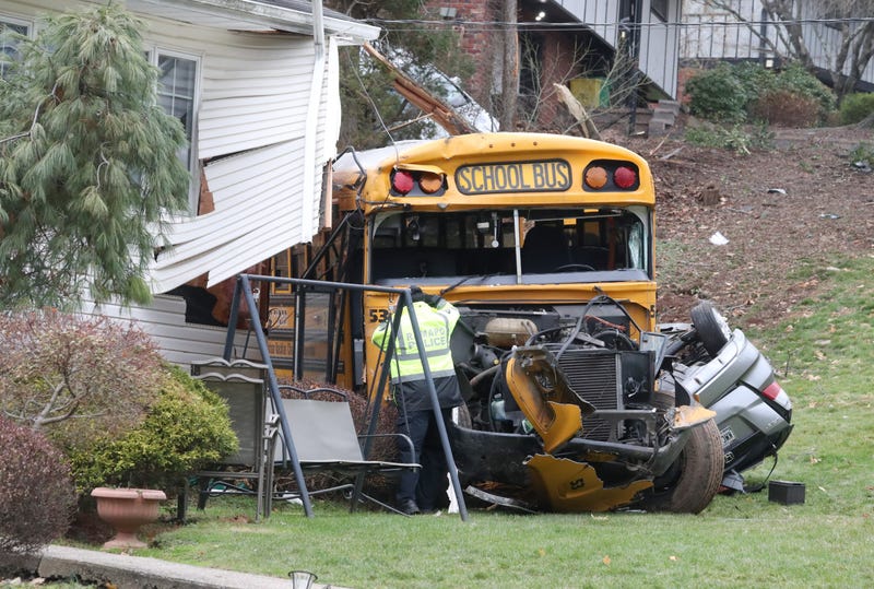 A school bus ran off of Southgate DR. In New Hempstead, hitting a parked minivan and crashed into a house Dec. 1, 2022. 