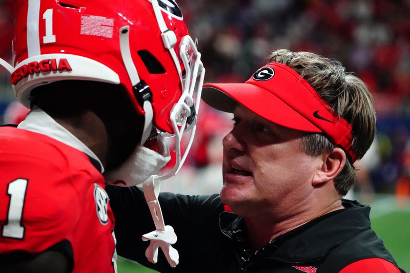 Dec 3, 2022; Atlanta, GA, USA; Georgia Bulldogs head coach Kirby Smart talks with Georgia Bulldogs wide receiver Marcus Rosemy-Jacksaint (1) after a touchdown during the third quarter of the SEC Championship game against the LSU Tigers at Mercedes-Benz Stadium. Mandatory Credit: John David Mercer-USA TODAY Sports
