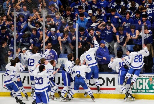 Catholic Central players celebrate 5-12 win over Brighton at the Division 1 hockey state final at the USA Hockey Arena in Plymouth on Saturday, March 12, 2022.