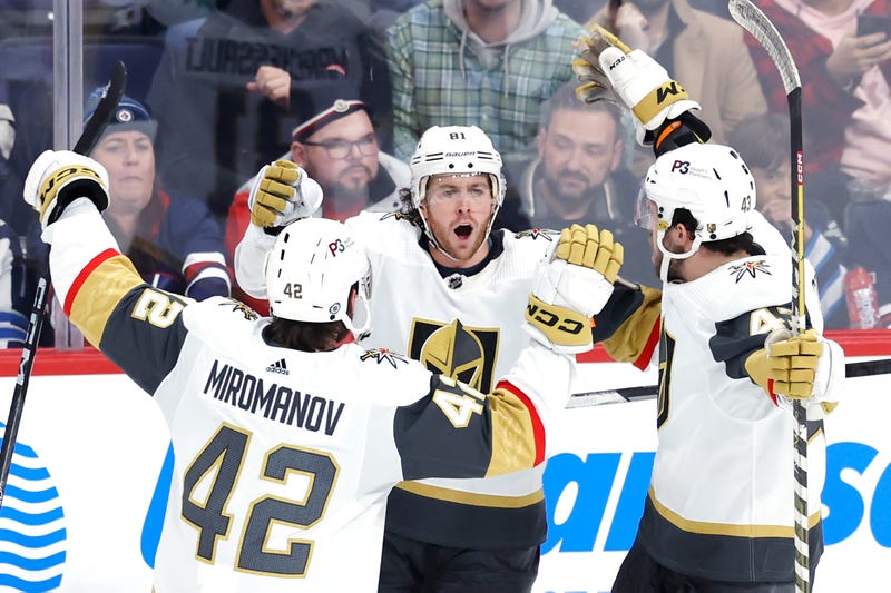Vegas Golden Knights center Jonathan Marchessault (81) celebrates his third period goal with Vegas Golden Knights defenseman Daniil Miromanov (42) and Vegas Golden Knights center Paul Cotter (43) against the Winnipeg Jets at Canada Life Centre.