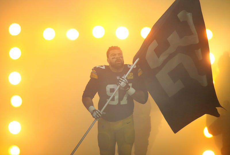 Cam Heyward carrying Franco Harris flag