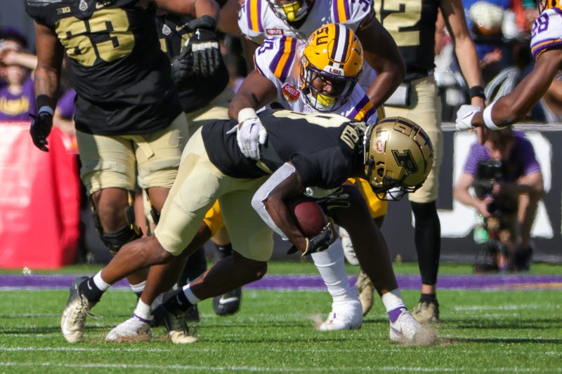 Purdue Boilermakers wide receiver TJ Sheffield (8) is tackled by LSU Tigers linebacker Greg Penn III