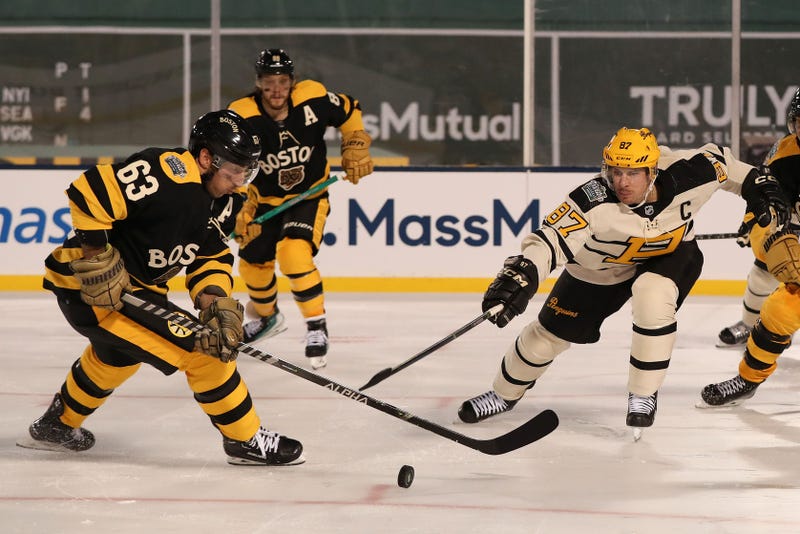 Boston Bruins left wing Brad Marchand (63) skates against Pittsburgh Penguins center Sidney Crosby (87)
