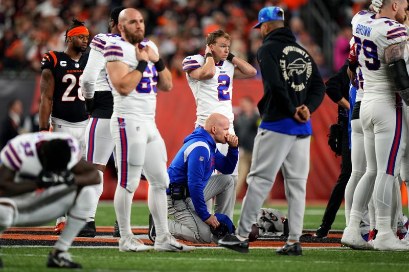 Buffalo Bills head coach Sean McDermott takes a knee is as Buffalo Bills safety Damar Hamlin is tended to on the field following a collision in the first quarter of a Week 17 NFL game against the Cincinnati Bengals