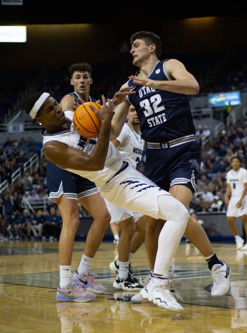 Nevada guard Kenan Blackshear (13) falls down with the ball at Lawlor Events Center on Jan. 13, 2023