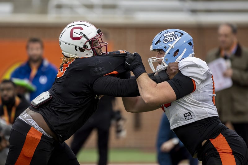 American defensive lineman Zacch Pickens of South Carolina (3) spars with American offensive lineman Nick Saldiveri of Old Dominion (59) practices during the third day of Senior Bowl week at Hancock Whitney Stadium in Mobile.
