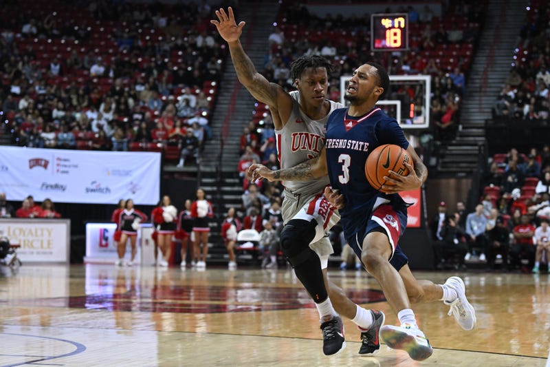 UNLV Runnin' Rebels guard Elijah Parquet (1) defends against Fresno State Bulldogs guard Isaiah Hill (3) in the second half at Thomas & Mack Center.