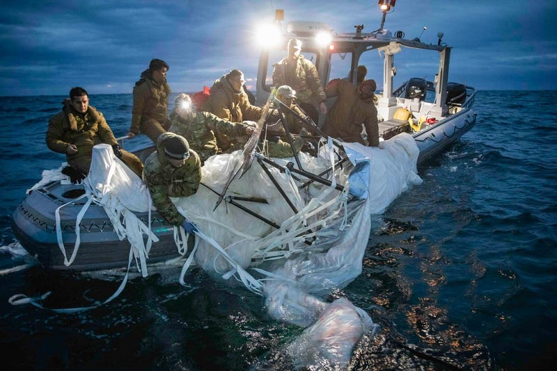 Sailors assigned to Explosive Ordnance Disposal Group 2 recover a high-altitude surveillance balloon off the coast of Myrtle Beach, South Carolina, Feb. 5, 2023. At the direction of the president, fighter aircraft engaged and brought down the balloon within sovereign U.S. airspace and over U.S. territorial waters Feb. 4, 2023.
