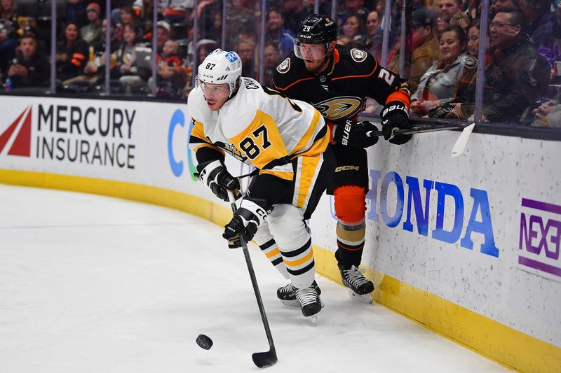 Pittsburgh Penguins center Sidney Crosby (87) controls the puck against Anaheim Ducks defenseman Dmitry Kulikov (29) 