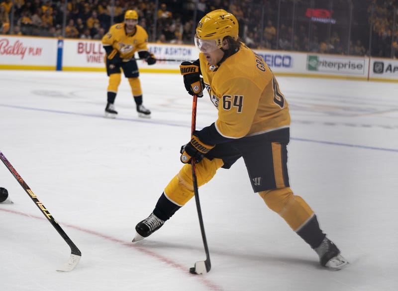 Mikael Granlund shooting a puck with Nashville