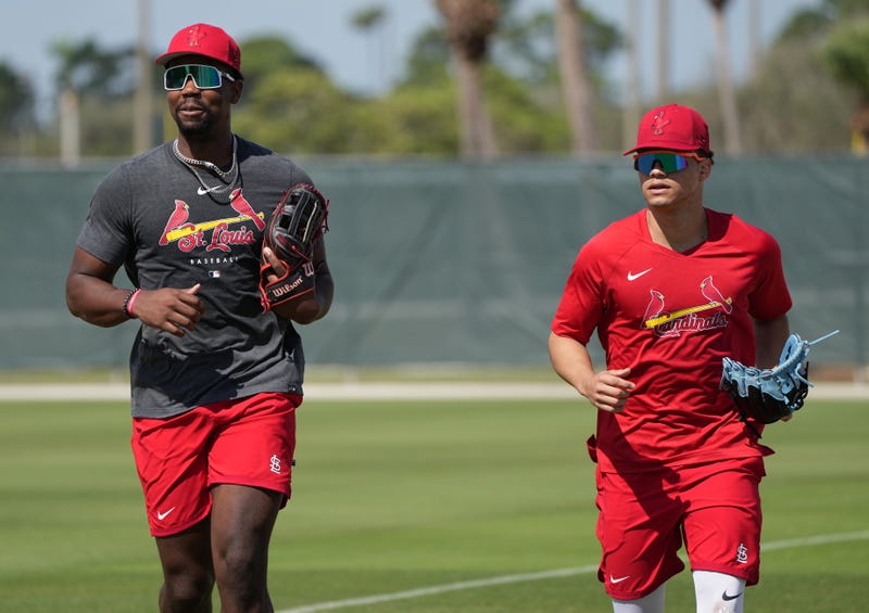 St. Louis Cardinals outfielder Jordan Walker, left, and Masyn Winn jog between workout stations during spring training in Jupiter, Florida