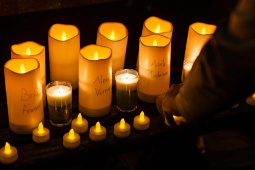 Talyce Murray, who graduated from Michigan State University in 2020, prepares candles for a vigil at DuPont Circle in Washington, D.C. on February 16, 2023, to honor victims of the shooting on the campus of Michigan State University. Three people were killed and 5 wounded by a lone gunman.