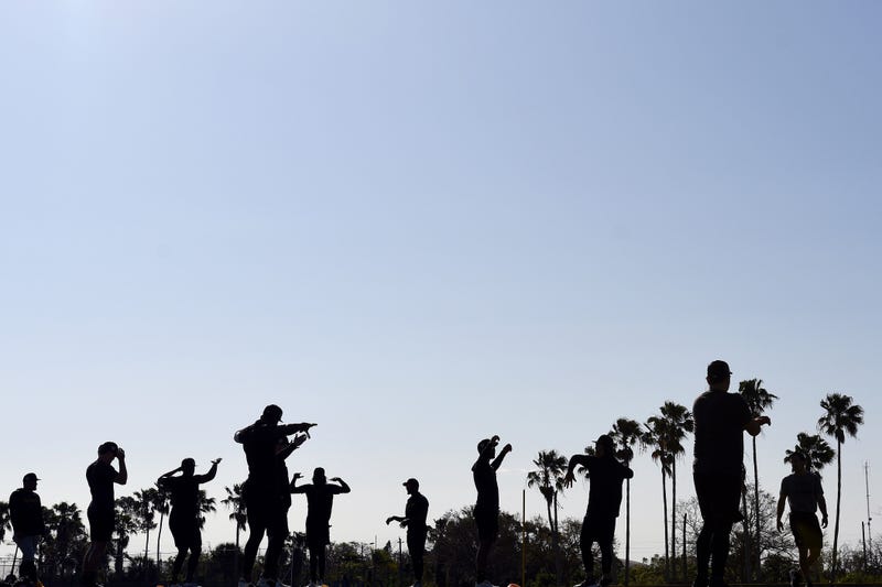 Bradenton, FL, USA; Members of the Pittsburgh Pirates warm up during spring training.