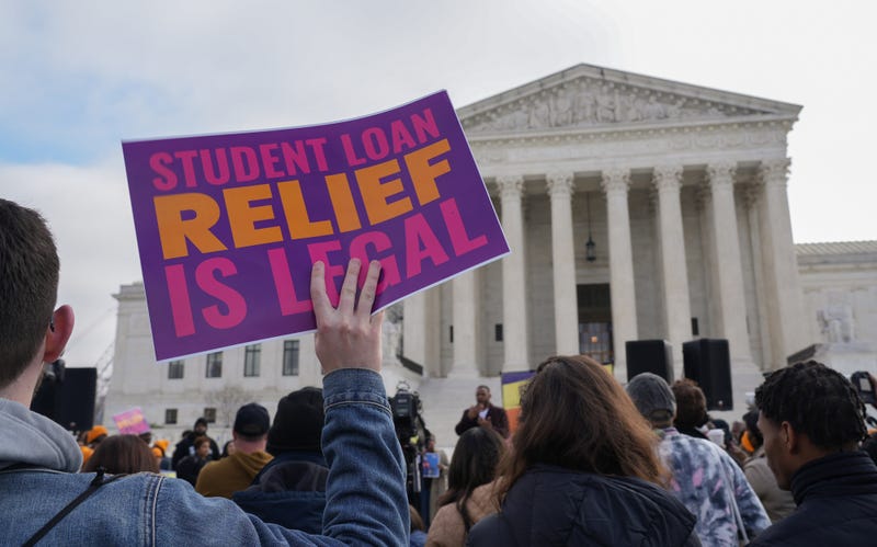 Protesters gather outside the U.S. Supreme Court on Feb. 28, 2023, ahead of the oral arguments in two cases that challenge President Joe Biden's $400 billion student loan forgiveness plan.