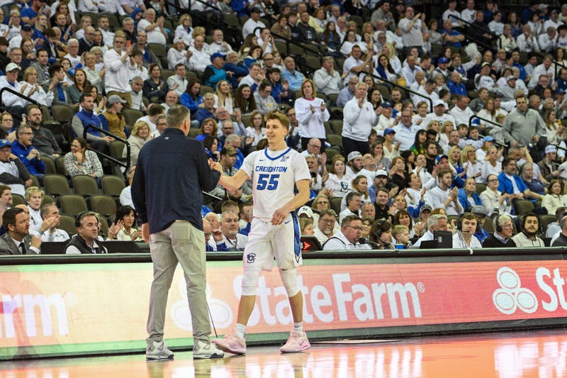 Omaha, Nebraska, USA; Creighton Bluejays guard Baylor Scheierman (55) shakes hands with head coach Greg McDermott after being taken out for the final time during Senior Night against the Georgetown Hoyas in the second half at CHI Health Center Omaha