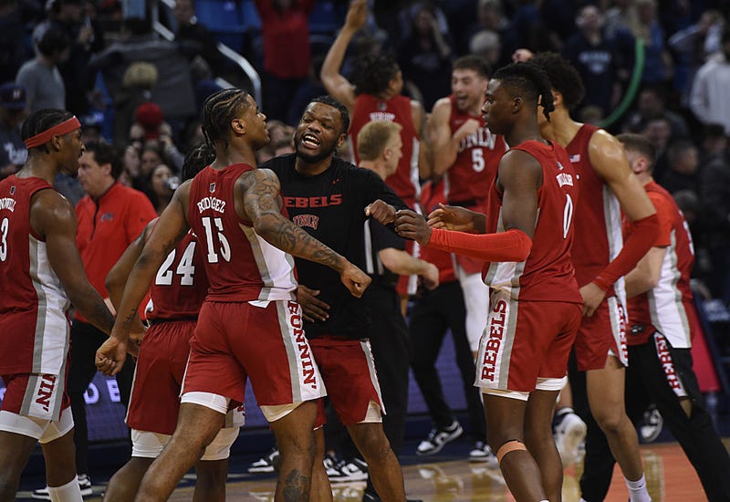 UNLV celebrates after defeating Nevada in overtime at Lawlor Events Center in Reno on March 4, 2023.