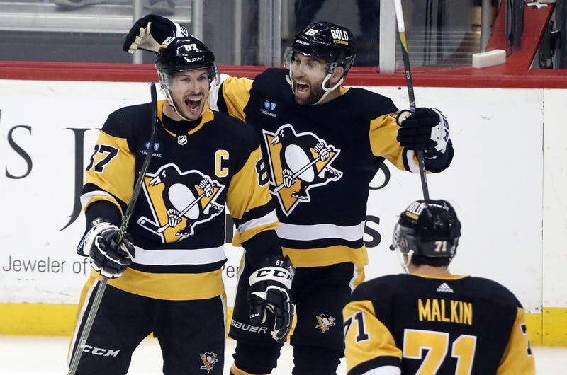 Sidney Crosby celebrates with Malkin and Zucker