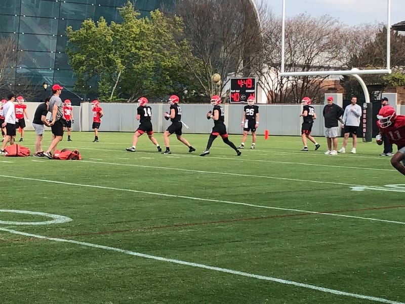 Georgia quarterbacks Gunner Stockton, Brock Vandagriff and Carson Beck with offensive coordinator Mike Bobo on March 16, 2023. Ugaqbsbobo