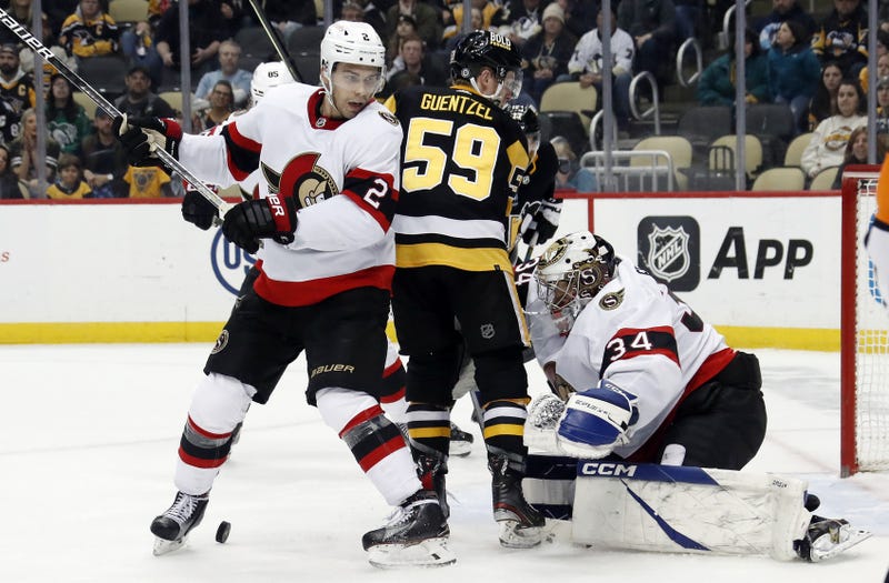 Jake Guentzel trying to score on Dylan Ferguson