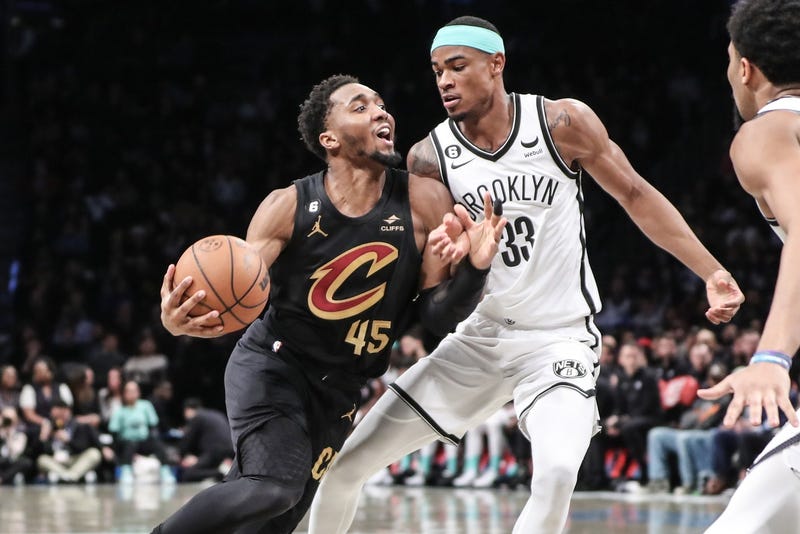  Cleveland Cavaliers guard Donovan Mitchell (45) looks to drive past Brooklyn Nets center Nic Claxton (33) in the second quarter at Barclays Center.
