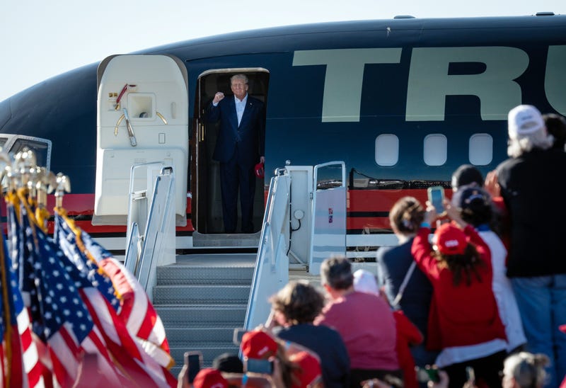 Former President Donald Trump gets off his plane after landing at the Waco Regional Airport for his Make America Great Again Rally in Waco, Texas, March 25, 2023.