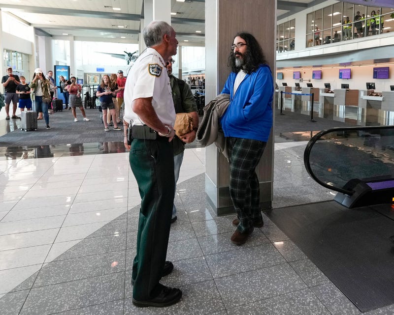 Volusia County Sheriff Mike Chitwood greets extraditied prisoner Richard Golden at Orlando Sanford International Airport, Monday, March 27, 2023.