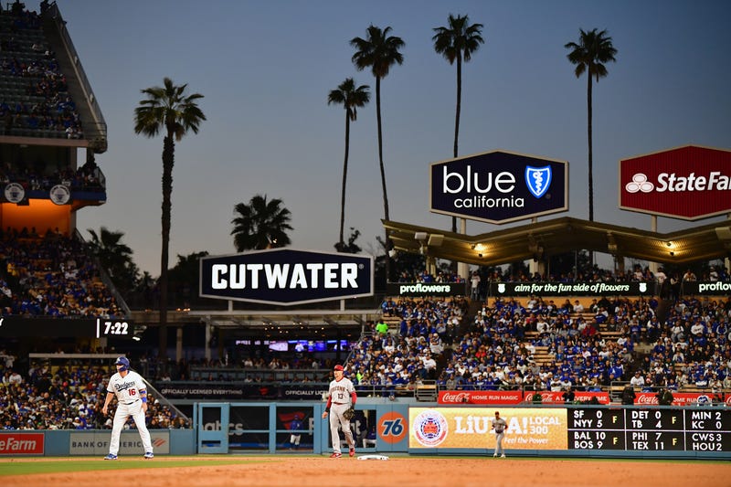 Mar 30, 2023; Los Angeles, California, USA; Los Angeles Dodgers catcher Will Smith (16) leads off from second ahead of Arizona Diamondbacks shortstop Nick Ahmed (13) during the first inning at Dodger Stadium.