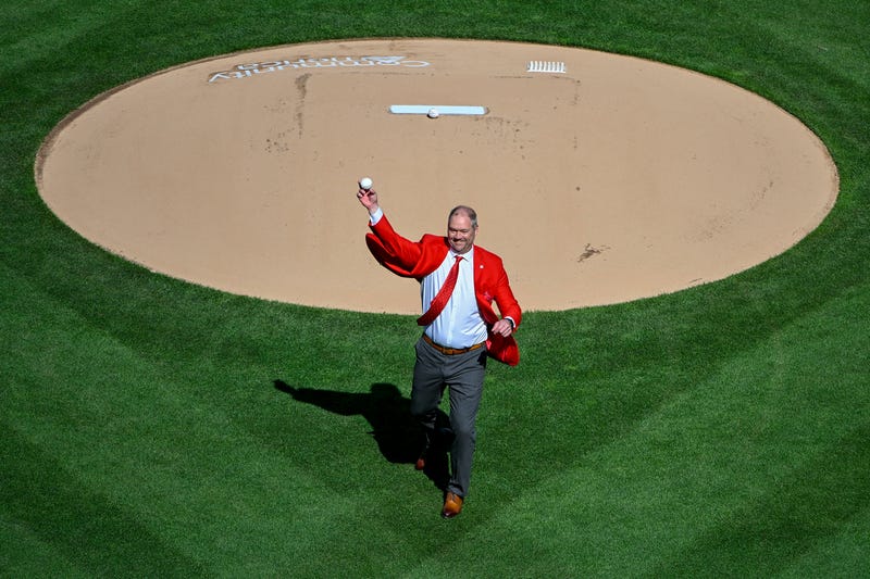 Former St. Louis Cardinal and hall of fame third baseman Scott Rolen throws out a first pitch before an opening day game.