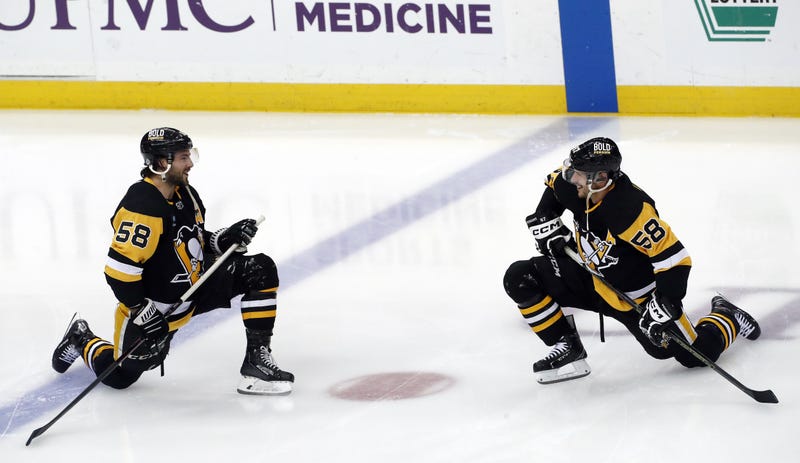 Sidney Crosby and Kris Letang in 58 jerseys in warmups