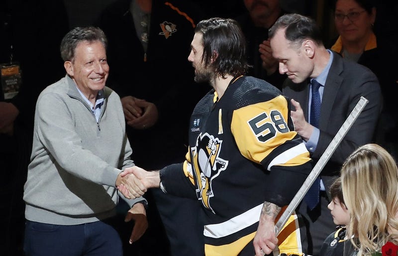 Pennsylvania, USA; Fenway Sports Group chairman Tom Werner (left) and Pittsburgh Penguins president Kevin Acklin (right) congratulate defenseman Kris Letang (58) 