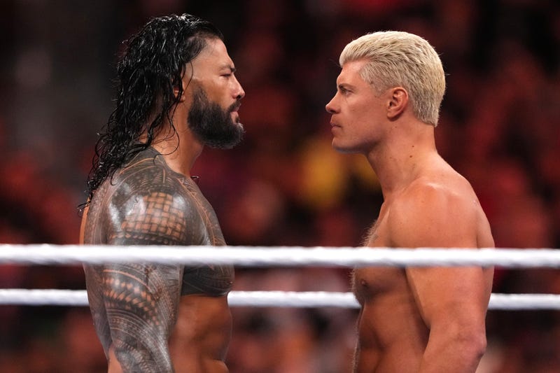 From left: Roman Reigns and Cody Rhodes square off during Night 2 of WrestleMania, April 2, 2023, at SoFi Stadium in Inglewood, California.