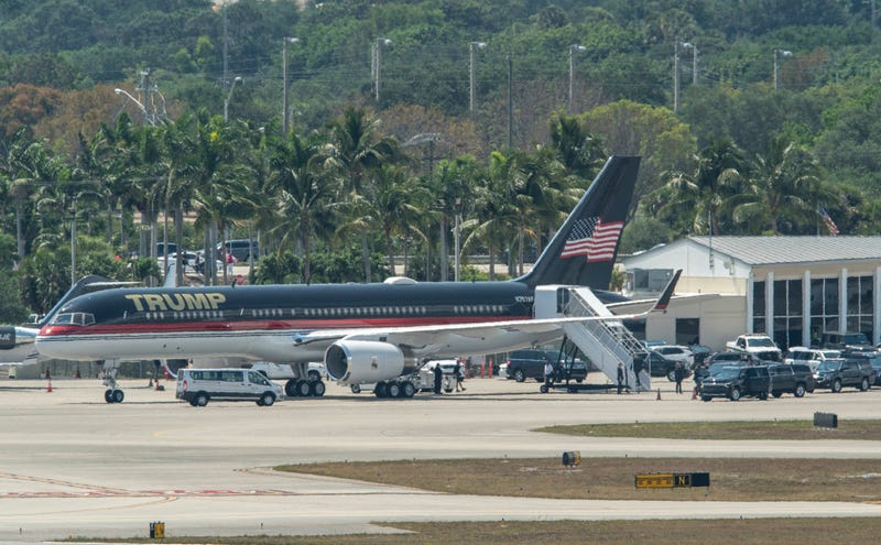 Former President Donald Trump boards his plane at Palm Beach International Airport in West Palm Beach, Florida, on April 3, 2023