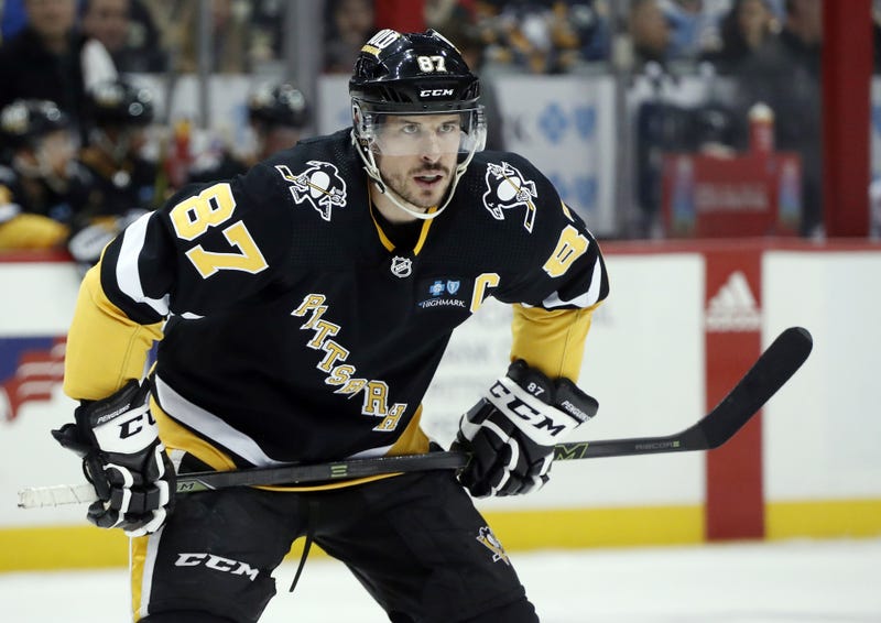 Sidney Crosby looking on ice