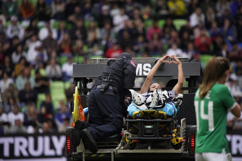Apr 8, 2023; Austin, Texas, USA; U.S. Women's National Team forward Mallory Swanson (9) is escorted off field by medical personnel during the first half in a match against the Republic of Ireland Women's National Team at Q2 Stadium.