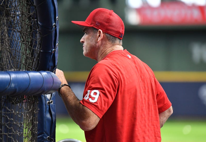 St. Louis Cardinals hitting coach Turner Ward (49) watches St. Louis Cardinals center fielder Tyler O'Neill (27) take batting practice before their game against Milwaukee Brewers at American Family Field.