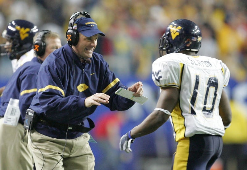Rich Rodriguez talking to Slaton at WVU