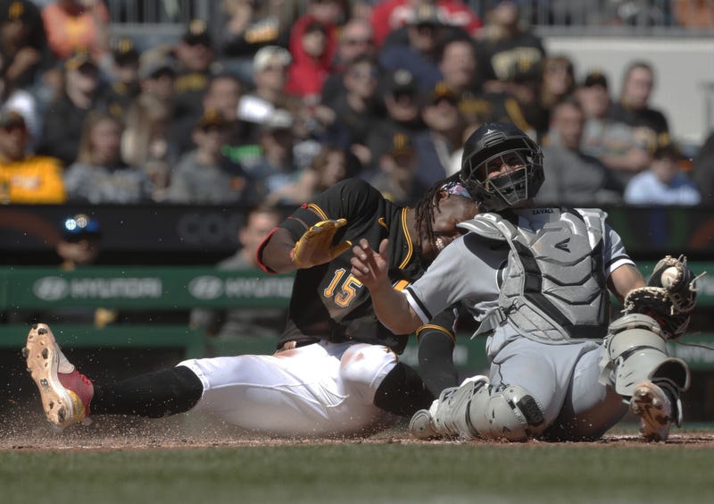 Chicago White Sox catcher Seby Zavala (44) tags Pittsburgh Pirates shortstop Oneil Cruz (15) out at home plate attempting to score during the sixth inning 