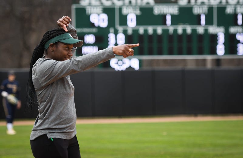 Michigan State softball coach Sharonda McDonald-Kelley sends hand signals to her Spartan softball team during a game against Notre-Dame, Tuesday, April 11, 2023, at Secchia Stadium in East Lansing.