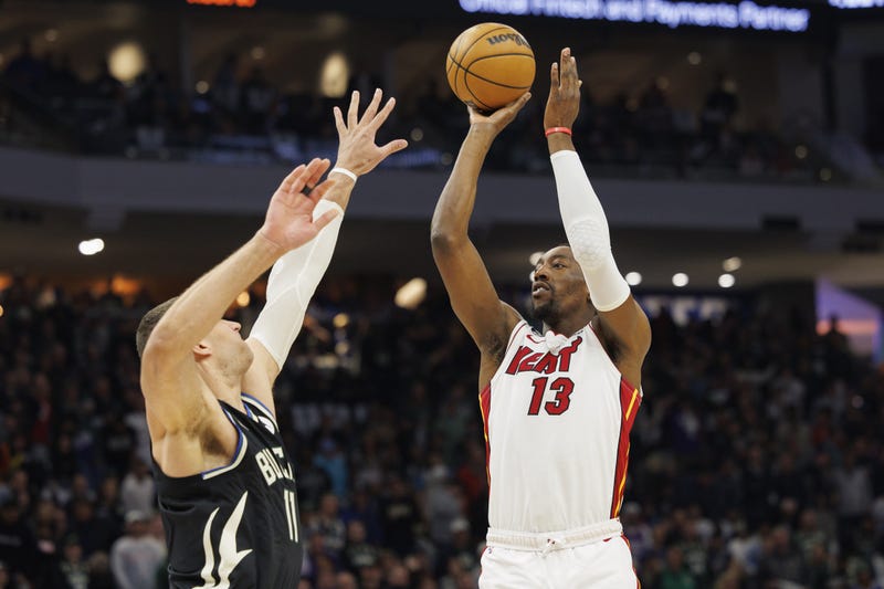 Bam Adebayo shoots against Brook Lopez during game two of the 2023 NBA Playoffs at Fiserv Forum. 