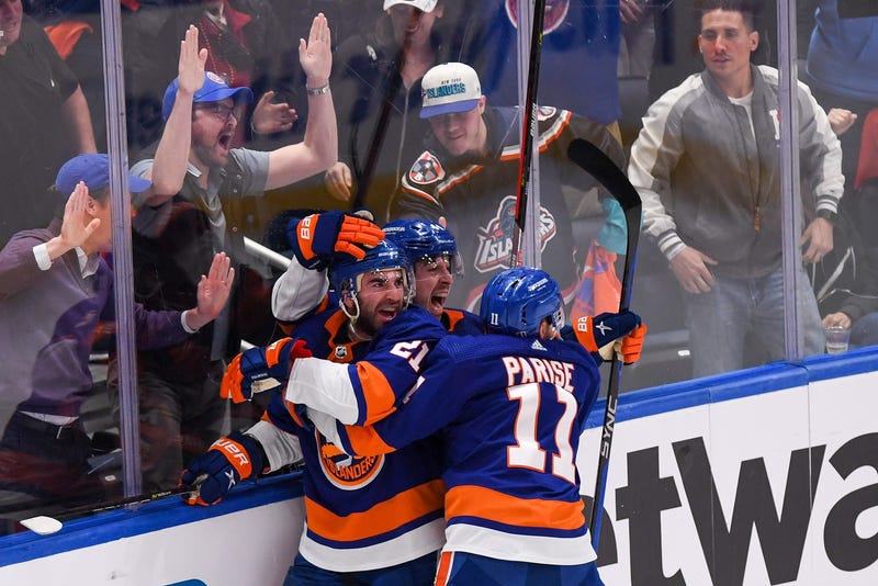 Apr 21, 2023; Elmont, New York, USA; New York Islanders center Kyle Palmieri (21) celebrates his goal against the Carolina Hurricanes with left wing Zach Parise (11) and center Jean-Gabriel Pageau (44) during the third period in game three of the first round of the 2023 Stanley Cup Playoffs at UBS Arena. Mandatory Credit: Dennis Schneidler-USA TODAY Sports